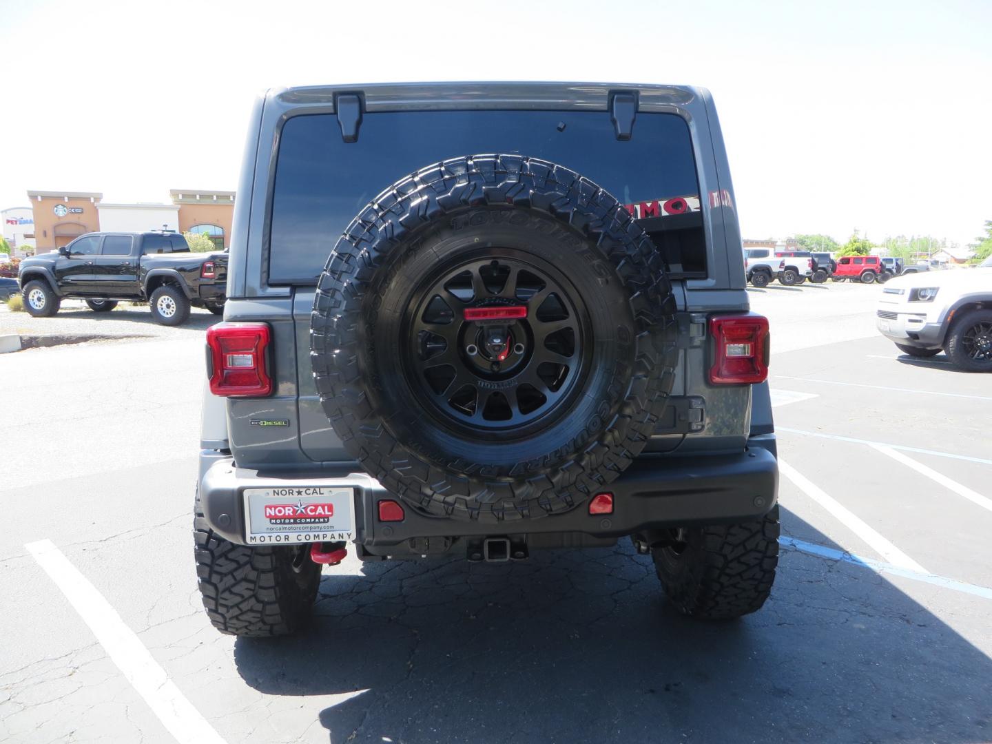 2021 Sting Grey /BLACK Jeep Wrangler Unlimited Rubicon (1C4JJXFM5MW) with an 3.0L V6 DOHC 24V TURBO DIESEL engine, 6A transmission, located at 2630 Grass Valley Highway, Auburn, CA, 95603, (530) 508-5100, 38.937893, -121.095482 - Diesel JL with Sky One power top featuring a Teraflex suspension system, Falcon adjustable shocks & steering stabilizer, Full Metal Cloak skid plate, 17" Method bead grip wheels, 37" Toyo RT Trail tires, Warn winch, Rigid Led lighting, Teraflex HD spare tire carrier, Teraflex Diff covers, Amp steps, - Photo#5